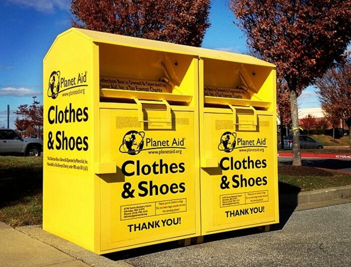 Two yellow Planet Aid drop bins