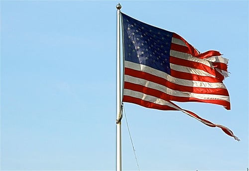 Flag that torn and flying high