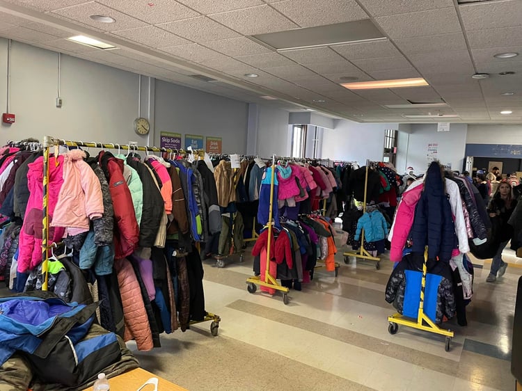 Racks of coats at Coat giveaway at Eugenio de Maria de Hostos Charter School