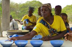 School workers setting out the corn-soy blend porridge for the students
