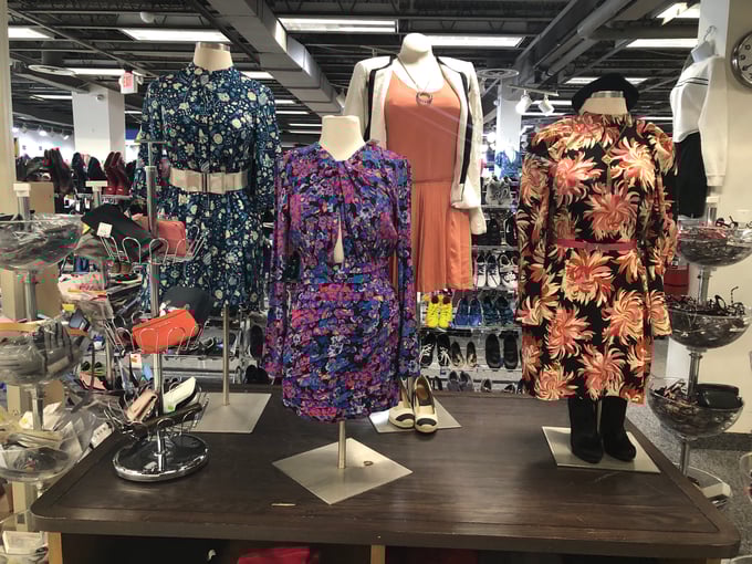 Mannequins outfitted with reusable clothing at the Planet Aid Thrift Store