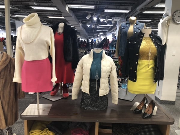 Different outfits on store figures