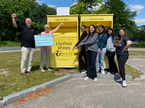 Milford High School Check Presentation for Earth Month Clothing Drive