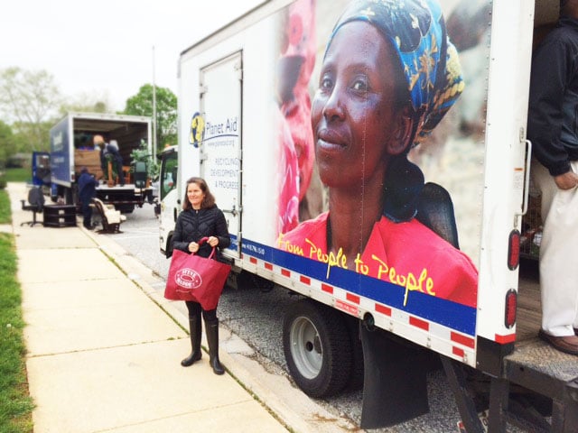 Woman donates to Planet Aid during Spring Clean Out