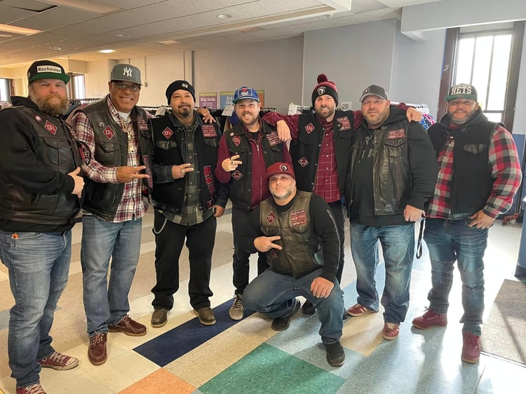 Redrum Motorcycle Society volunteers at coat giveaway