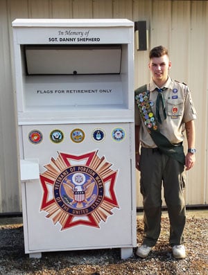 Logan Keenan refurbishes Planet Aid bin for Eagle Scout project