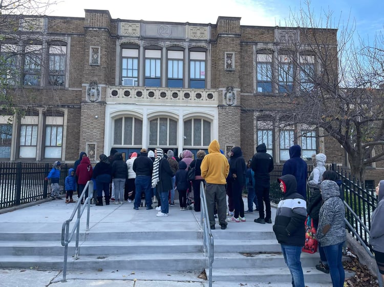 Rochester residents wait to come in for the coat giveaway on November 19. at 11 am