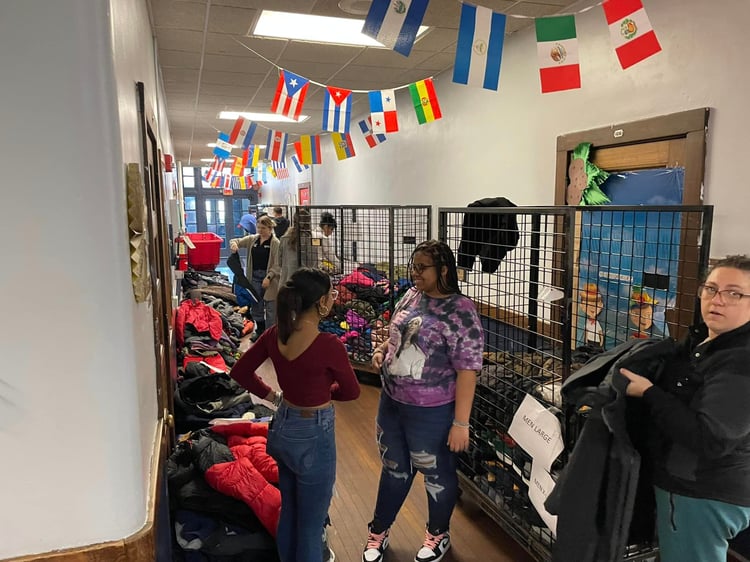 Volunteers helping at 9th Annual Free Coat Giveaway.