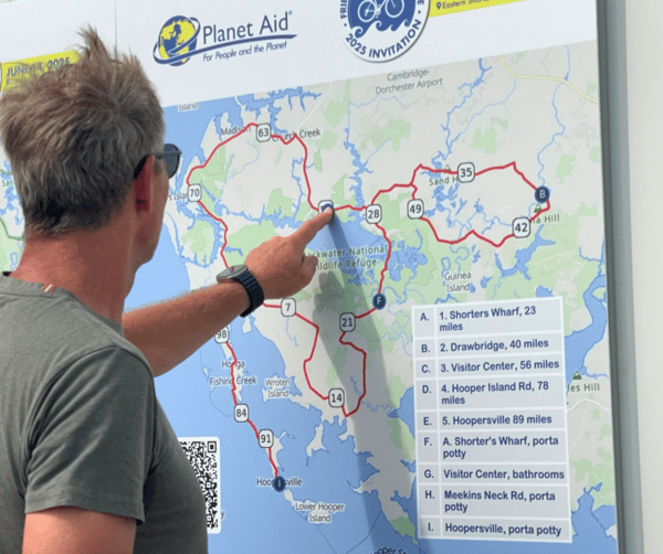 Man looking at 100 mile route